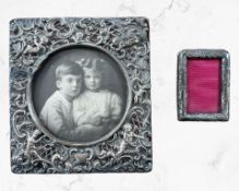 Two antique silver-mounted photo frames, largest 16cm by 15cm, both lacking back rests.