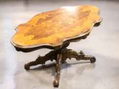 An Italian style inlaid shaped top coffee table, length 115 cm.