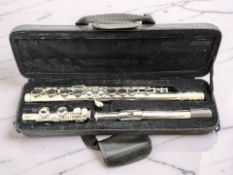 A three-piece silver-plated flute signed Glory, GLF-130, in case.