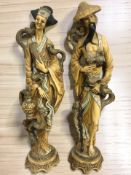 A pair of oriental resin figures, height 49 cm.