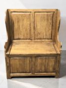 A 20th century elm storage settle, width 87 cm.