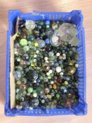 A collection of marbles, paperweight, crystal ring tray, etc.