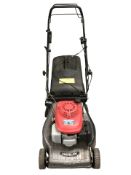 A Mountfield petrol lawnmower.