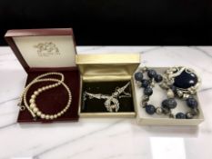 A lapis lazuli necklace, strand of costume pearls,