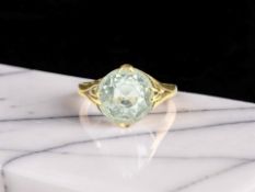 A blue topaz solitaire ring in yellow gold, size M CONDITION REPORT: Marks rubbed. 3.