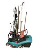 A Bosch electric lawnmower, a Titan pole hedge trimmer and various hand tools.