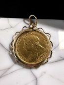 A Victorian half sovereign 1900 in 9ct gold mount CONDITION REPORT: 5.