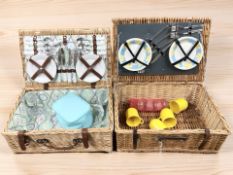 Two vintage picnic sets in wicker hampers