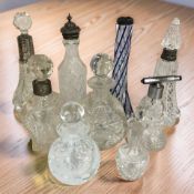 A group of crystal dressing table jars including some with silver mounts, tallest 18 cm.