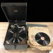 A His Master's Voice table top record player and a quantity of vinyl 78's.