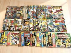 A collection of vintage Marvel Comics including Captain Britain, The Avengers and Super Spider-Man.
