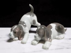 Two Lladro figures of puppies, length 16 cm,