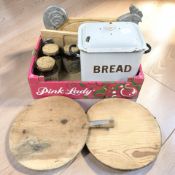 A vintage enamelled bread bin, three Pearsons of Chesterfield storage jars,