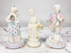 A pair of 19th century French Vion & Baury bisque porcelain figures of a lady and gentleman in 18th