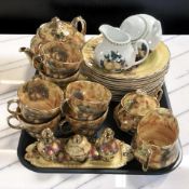 A collection of English porcelain tea wares decorated with fruit and two pieces of Waterside