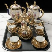 A fifteen piece gilt tea set and two further House of Faberge teapots.