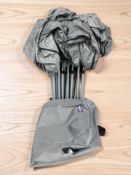 A folding camp bed, in bag.