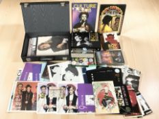 A collection of Boy George and Culture Club ephemera including pin badges,