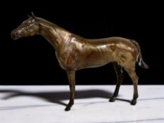 A 19th century patinated metal figure of a horse,