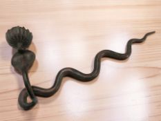 An Indian Benares enameled brass candle sconce in the form of a king cobra, length 59 cm.