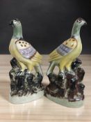 A pair of Victorian Staffordshire figures of wood pigeons, height 25 cm.