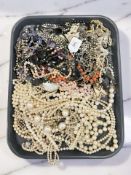 A tray of costume jewellery, simulated pearl necklaces, etc.
