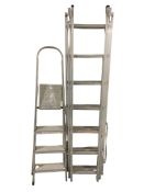An aluminium triple extension ladder and a step ladder.