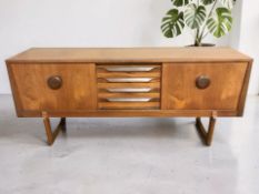 A 1960's Elliotts of Newbury teak sideboard,