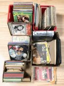 Assorted vinyl records including Elvis, vintage annuals including Guinness Book of Records, Giles,