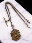 A 9ct gold watch Albert chain with T-bar and fob marked 'Won by J. Bell, 100yds Handicap, 1914'.