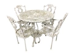 A cast aluminium garden patio table, diameter 90 cm, and a set of four armchairs.