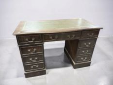 A reproduction mahogany nine drawer twin pedestal desk, 122 cm x 62 cm x 79 cm.