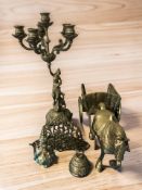 A brass figural candelabrum, model horse and carriage, letter rack, bell and a small brass teapot.