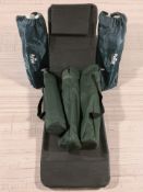 A woven plastic garden lounger and several other chairs in carry bags.