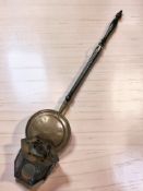 A small copper-effect hexagonal lantern and a copper bedwarming pan.