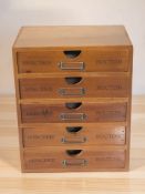 A reproduction French-style haberdashery chest, width 25 cm.