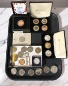 A collection of mainly crown sized coins including a set of three Jubilee Mint RNLI five pound