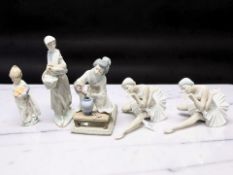 Two Lladro figures of seated ballerinas,