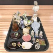 A Lladro figure of a girl holding a sun hat, various other porcelain and crystal ornaments.