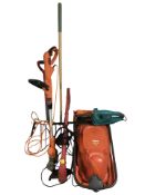 A Flymo mower, Black & Decker strimmer, Bosch hedge trimmer and other tools.