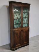 A 19th century mahogany double door corner cabinet, height 220 cm.