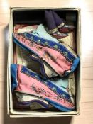 A pair of Chinese child's silk heeled shoes, length 13 cm,