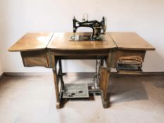 A Vesta sewing machine in walnut table.