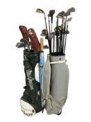 Two golf bags containing irons and drivers including Wilson, Memphis, etc.