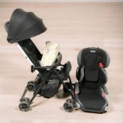 A Chicco lightweight folding pushchair with rain cover, and a Cath Kidston push chair caddy,