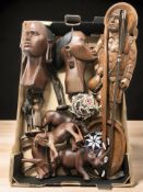 A group of African carved hardwood busts and figures, beadwork items, two riding crops, etc.
