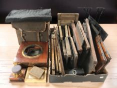 An antique mahogany plate camera and various parts.