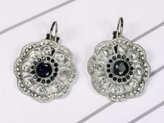 A pair of silver cluster earrings set with natural sapphire and cubic zirconia