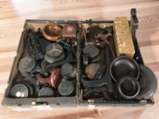 A collection of wooden stands, plate rests, hard wood bowls, etc.