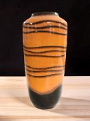 A West German orange glazed pottery vase, height 44 cm.